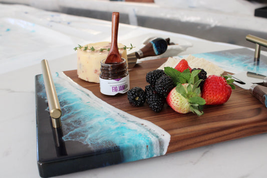 Black walnut serving tray styled with food as a thoughtful gift for mom for Mother’s Day