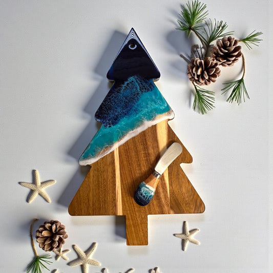 Daphnew Design Christmas tree shaped acacia wood cheese board with blue ocean resin art and matching cheese knife.